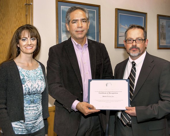 Media Fusion founder Tim McElyea displaying a NASA Armstrong Small Business Award in 2014
