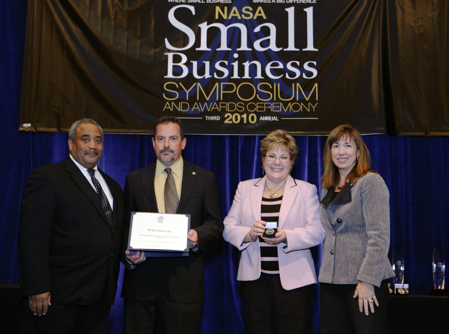 Media Fusion founder Tim McElyea receiving an award at the 2010 NASA Small Business Symposium Media Fusion founder Tim McElyea receiving an award at the 2010 NASA Small Business Symposium
